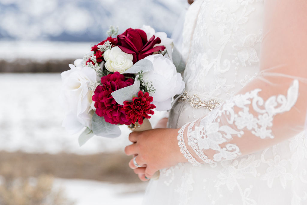 A winter bridal bouquet with pops of red | Jamye Chrisman | Wedding Photographer