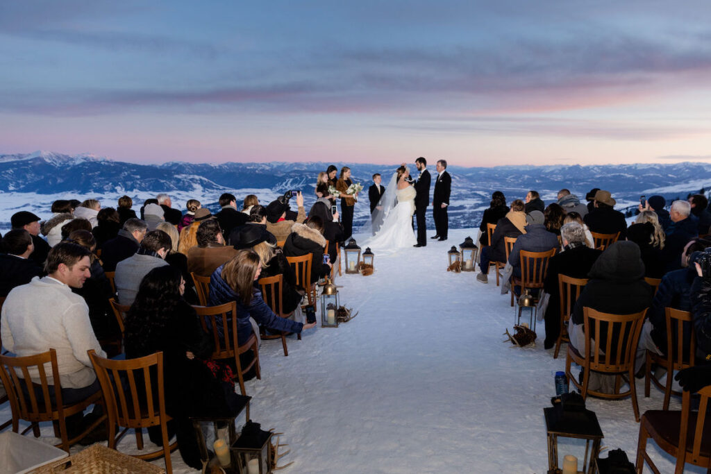 Early dusk during a winter wedding ceremony at Rendezvous Lodge Jackson Hole Mountain Resort | Jamye Chrisman | Wyoming Wedding Photographer