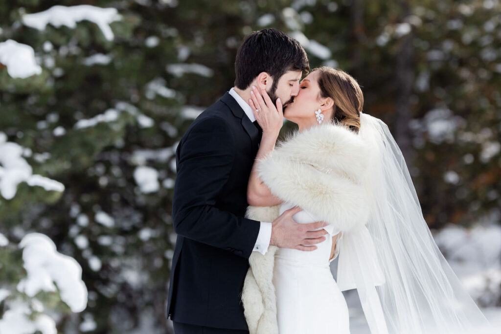 A bride wears a fur shawl during her winter wedding photoshoot in the Tetons | Jamye Chrisman | Jackson Hole Wedding Photographer