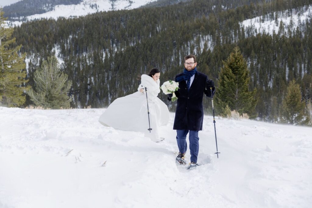 A couple snowshoeing to the Wedding Tree in Jackson Hole | Jamye Chrisman | Jackson Hole Wedding Photographer