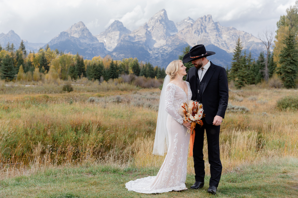 A happy couple poses after their intimate fall wedding in Grand Teton National Park, Wyoming | Jackson Hole Wedding Photographer Jamye Chrisman