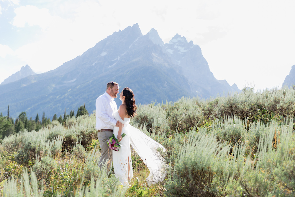 An elopement photoshoot in front of dramatic Teton peaks