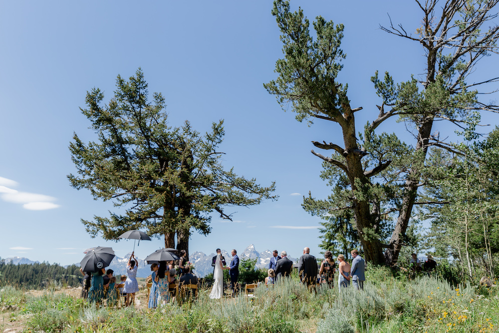 A summer micro wedding ceremony at the Wedding Tree in Jackson Hole Wyoming with the Tetons in the background