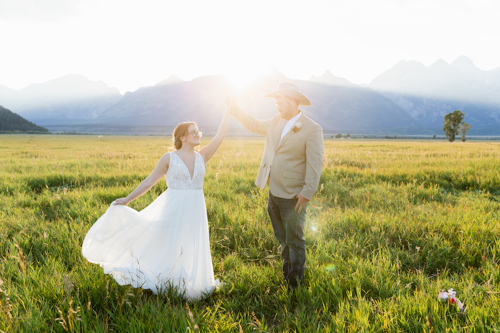 A wedding photo at golden hour sunset in Grand Teton National Park by Jackson Hole elopement photographer Jamye Chrisman