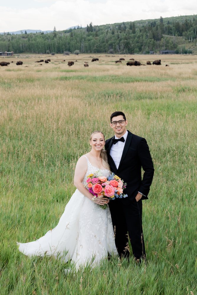 Seeing bison after getting married in the Tetons made this couple smile bigger! 